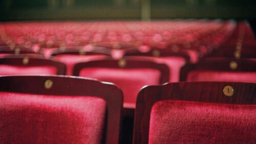 Empty Theater Red Velvet Seats Close Up 4K Desktop Wallpaper