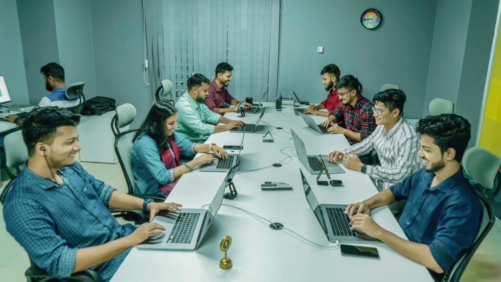 Professional Team Working Together in a Modern Office Desktop Wallpaper