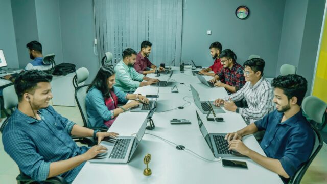 Professional Team Working Together in a Modern Office Desktop Wallpaper