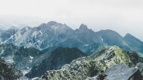 Rugged Mountain Peaks and Cloudy Alpine Scenery 4K Desktop Wallpaper