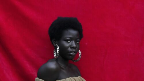 Stunning Portrait of a Woman with Silver Hoop Earrings 4K Wallpaper