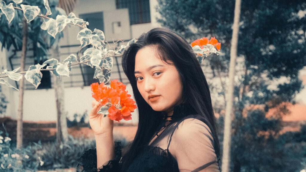 Beautiful Asian Girl With Bright Orange Bougainvillea Flowers 4K Wallpaper