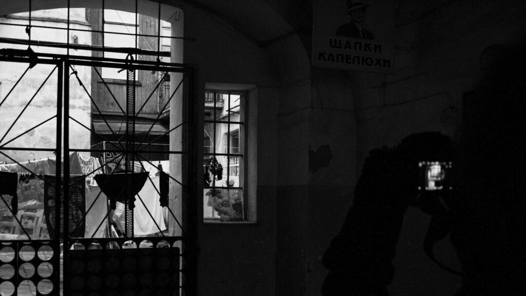 Black and White Cinematic Courtyard Scene Desktop Wallpaper