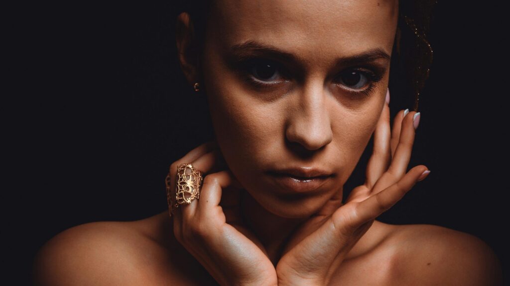 Elegant Woman With Gold Jewelry Moody Portrait 4K Wallpaper