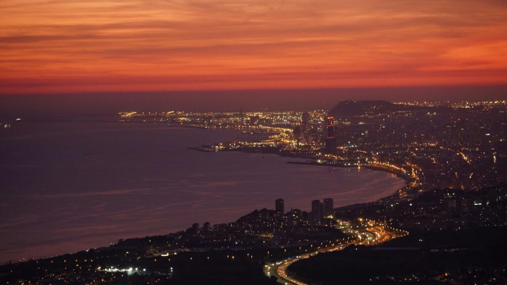 Breathtaking Sunset Cityscape Overlooking The Mediterranean Coast Desktop Wallpaper
