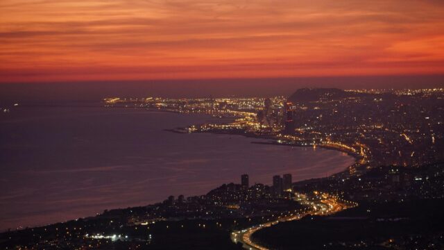 Breathtaking Sunset Cityscape Overlooking The Mediterranean Coast Desktop Wallpaper