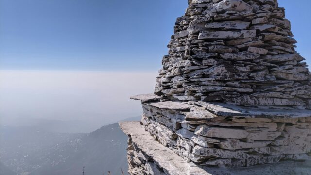 Zen Stone Stack Tower Over Misty Mountain Valley Desktop Wallpaper