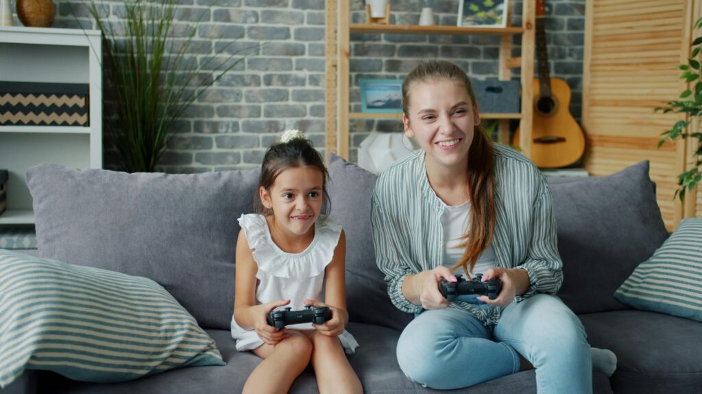 Happy Sister Playing Video Games Together 4K Desktop Wallpaper