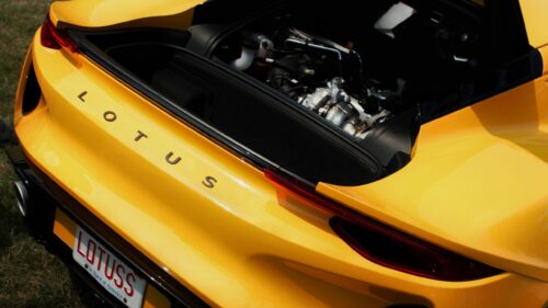 Vibrant Yellow Lotus Sports Car Rear Engine Detail 4K Wallpaper
