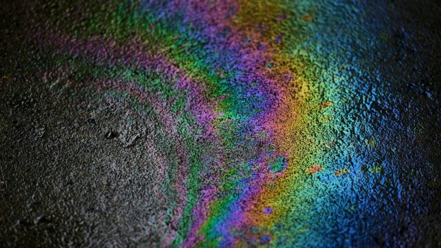 Mesmerizing Rainbow Oil Slick on Asphalt 4K Wallpaper