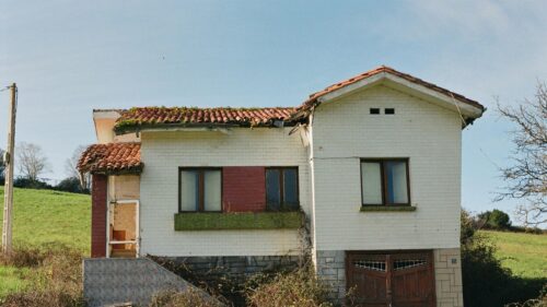 Abandoned Countryside House with Red Tiled Roof Desktop Wallpaper