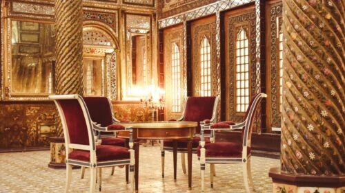 Luxurious Persian Palace Interior with Red Chairs 4K Wallpaper