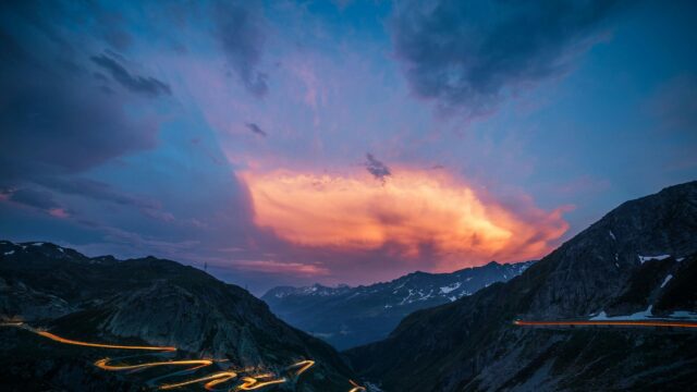 Stunning Winding Mountain Road at Sunset 4K Desktop Wallpaper