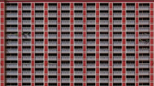 Symmetrical Red Apartment Building Architecture 4K Wallpaper