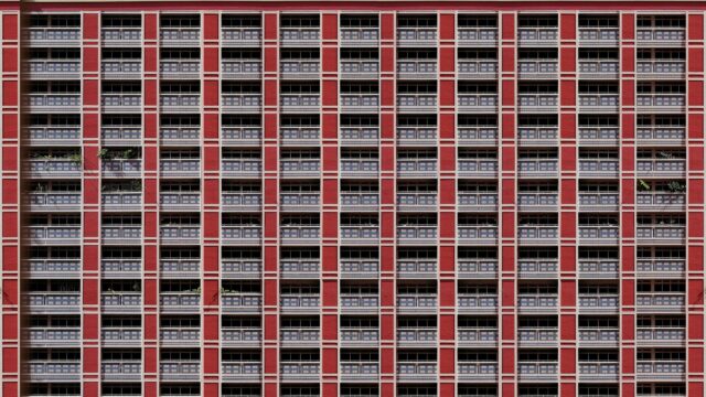 Symmetrical Red Apartment Building Architecture 4K Wallpaper