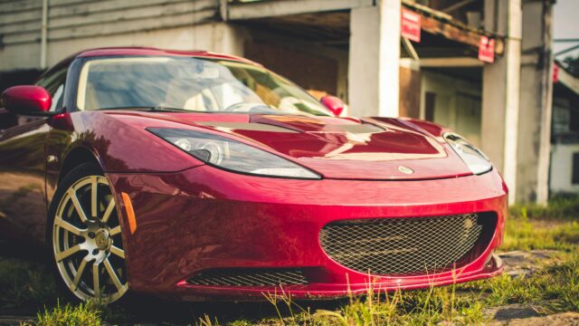 Red Lotus Evora Sports Car Parked Outdoors 4K Desktop Wallpaper