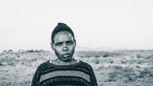 Stunning Portrait of an African Woman in the Savannah Desktop Wallpaper
