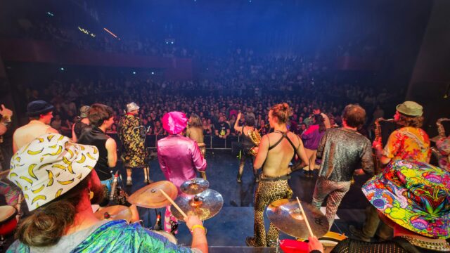 Eclectic Indie Band Performing on Stage Concert Desktop Wallpaper