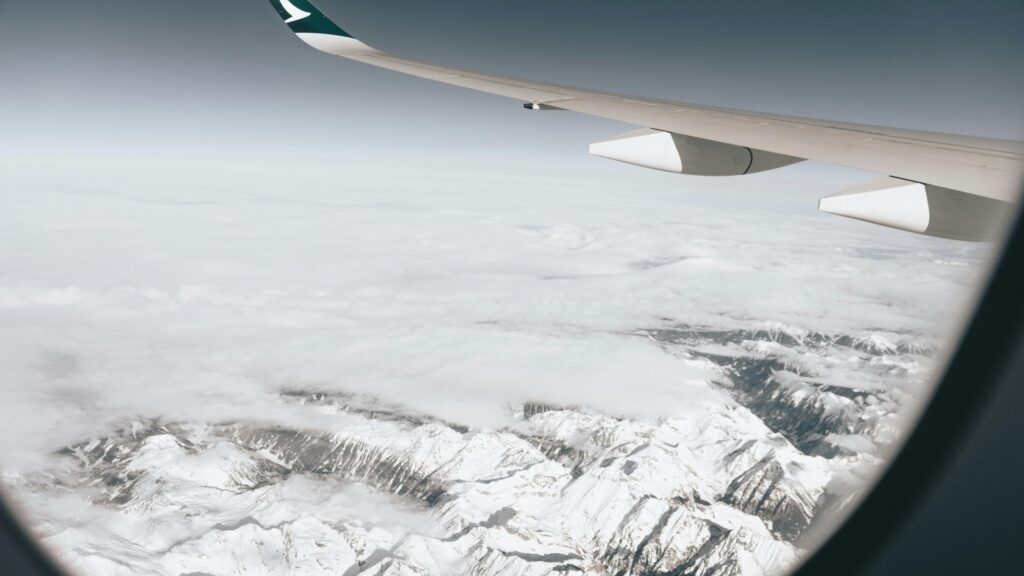 Breathtaking Aerial View of Snowy Mountain Peaks Desktop Wallpaper