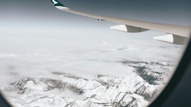 Breathtaking Aerial View of Snowy Mountain Peaks Desktop Wallpaper