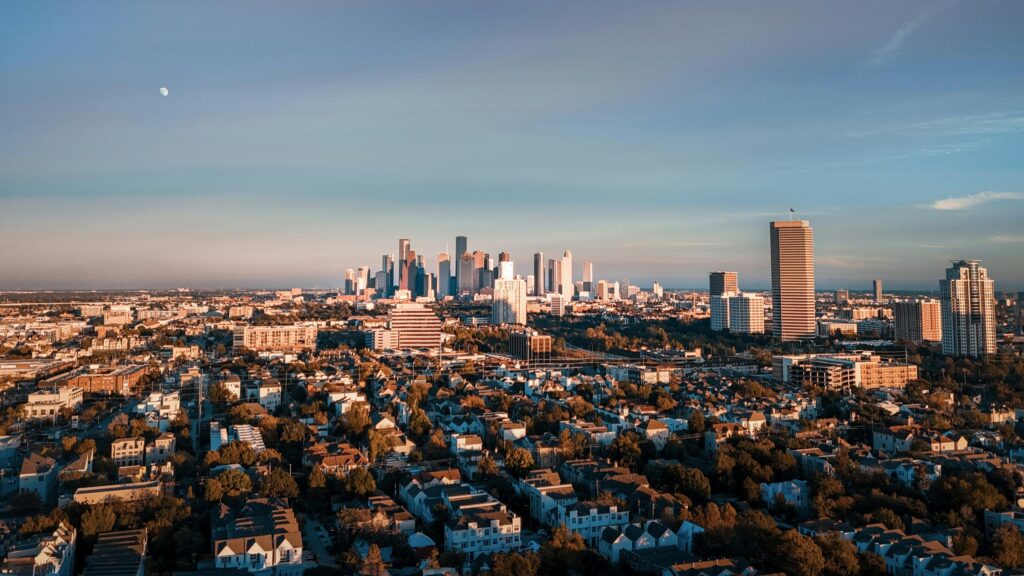 Golden Hour Houston City Skyline with Moon Aerial View Desktop Wallpaper