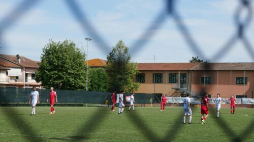 Amateur Football Match on a Sunny Day Desktop Wallpaper