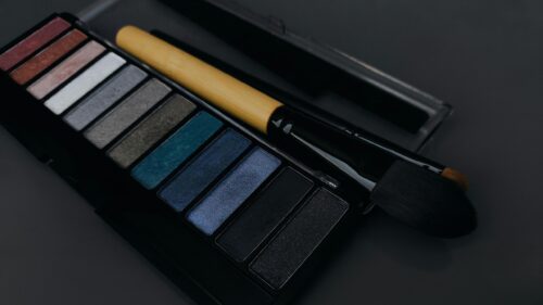 Elegant Eyeshadow Palette with Professional Makeup Brush 4K Wallpaper