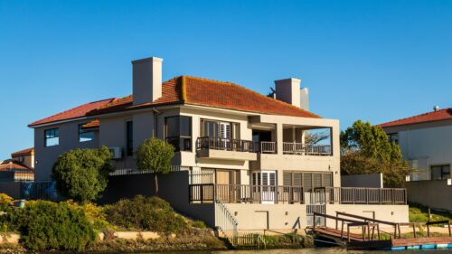 Stunning Waterfront Luxury House with Red Tiled Roof 4K Wallpaper
