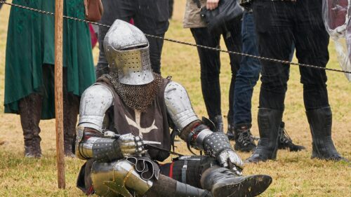 Medieval Knight Resting in Steel Armor 4K Desktop Wallpaper