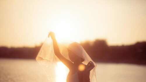 Dreamy Silhouette Woman with Veil at Golden Hour 4K Wallpaper