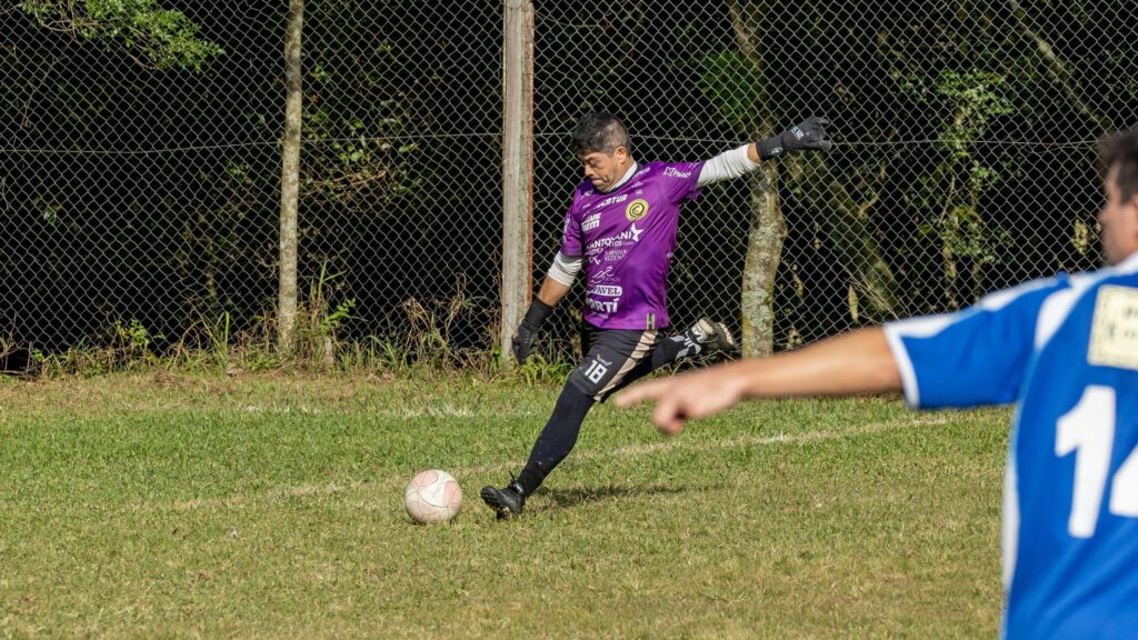 Soccer Goalkeeper Kicking Ball on Field Action 4K Wallpaper