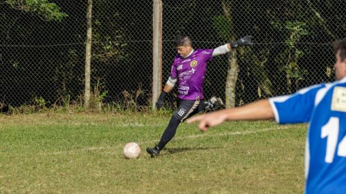 Soccer Goalkeeper Kicking Ball on Field Action 4K Wallpaper