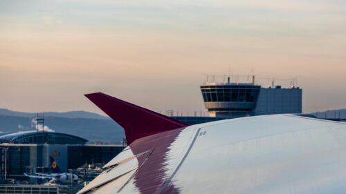 Winglet View of Airport Control Tower at Sunset Desktop Wallpaper