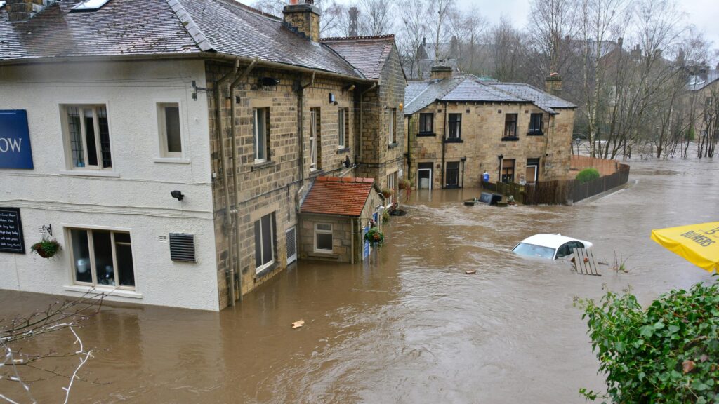 Severe River Flooding Submerging Houses and Car 4K Desktop Wallpaper
