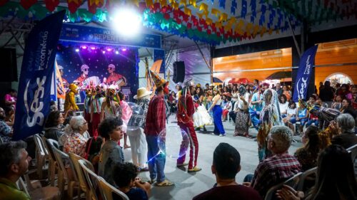 Vibrant Folk Festival Performance with Dancers and Performers 4K Wallpaper