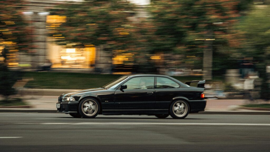 Black BMW E36 M3 Coupe Drifting in Motion 4K Desktop Wallpaper