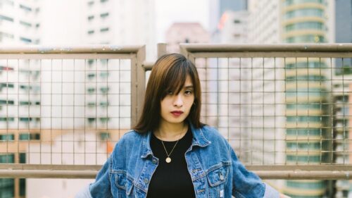 Asian Girl in Denim Jacket Portrait Urban Setting 4K Wallpaper