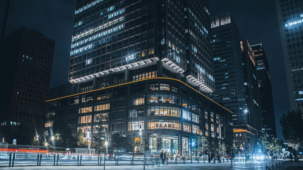 Tokyo Cityscape at Night with Illuminated BEAMS Building 4K Wallpaper