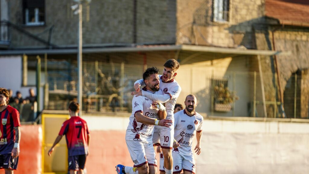 Soccer Players Celebrating a Goal in White Kits 4K Wallpaper