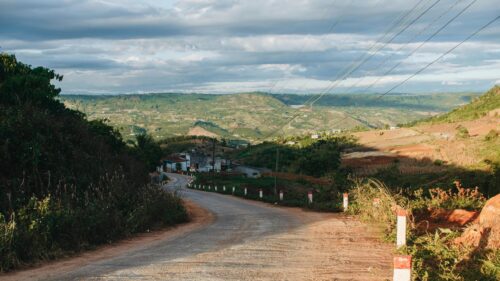 Scenic Winding Road Through Lush Vietnamese Highlands 4K Wallpaper