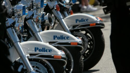 Row of Police Motorcycles Parked in a Line 4K Wallpaper