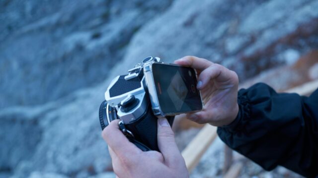 Close-Up of Photographer Capturing Vintage Camera Viewfinder PC Wallpaper