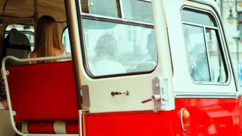Passengers Inside a Vintage Red Bus Desktop Wallpaper