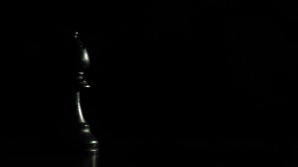 Minimalist Black Chess Bishop Piece Elegant Dark Desktop Wallpaper