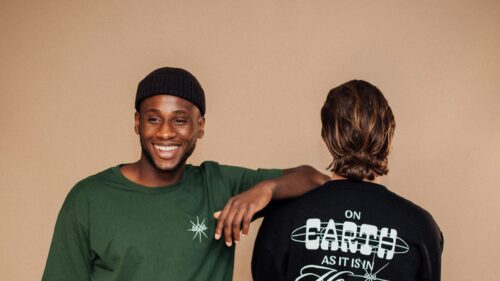 Two Stylish Men Smiling in Trendy Apparel 4K Wallpaper