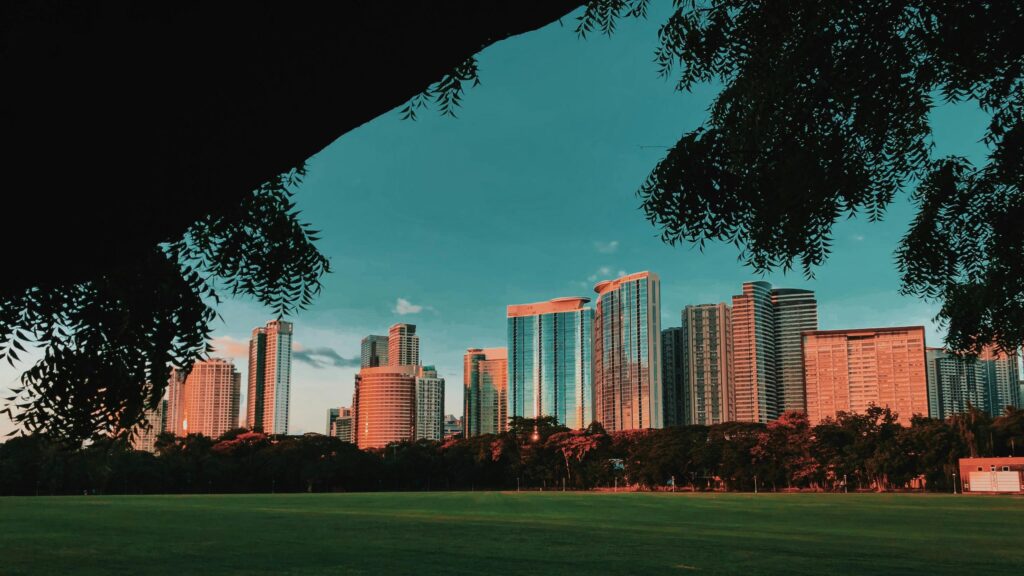 Golden Sunset Over Modern City Skyline Desktop Wallpaper