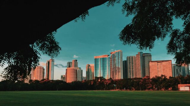 Golden Sunset Over Modern City Skyline Desktop Wallpaper