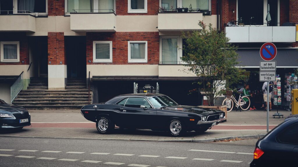 Classic Black Dodge Challenger Muscle Car on German Street 4K Wallpaper
