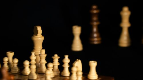 Macro Chess Pieces Strategic Game Board 4K Wallpaper