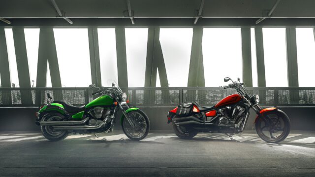 Two Custom Cruiser Motorcycles in Parking Garage 4K Wallpaper